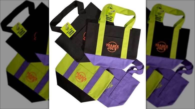 black, purple, and green canvas totes with logo