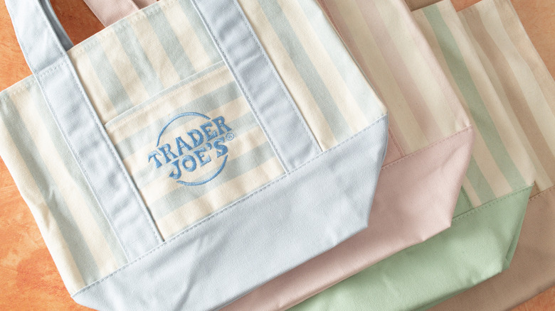 Top-down view of several Trader Joe's mini tote bags