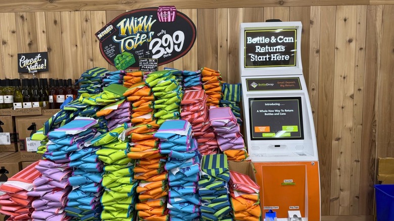 stack of trader joe's totes with bottle return