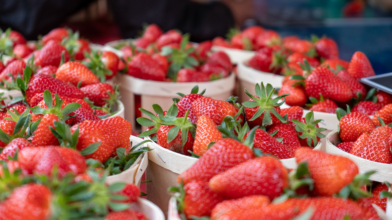 Closeup of small baskets holding strawberries.