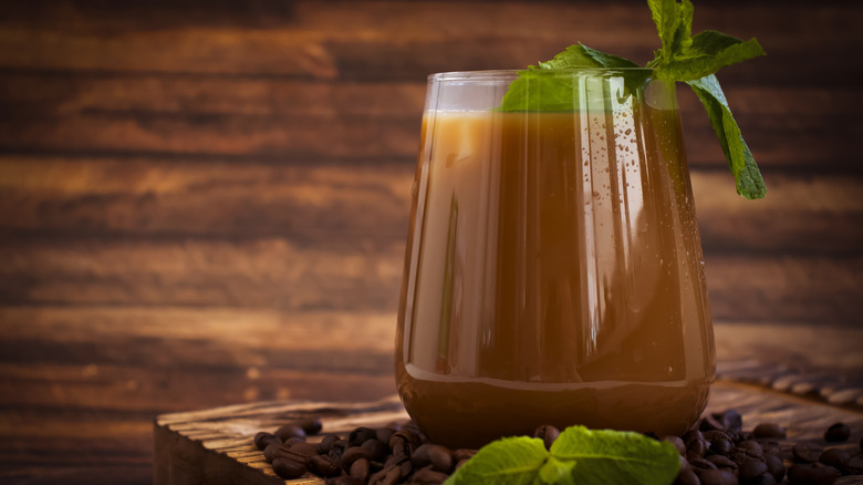 Glass of iced coffee with mint.