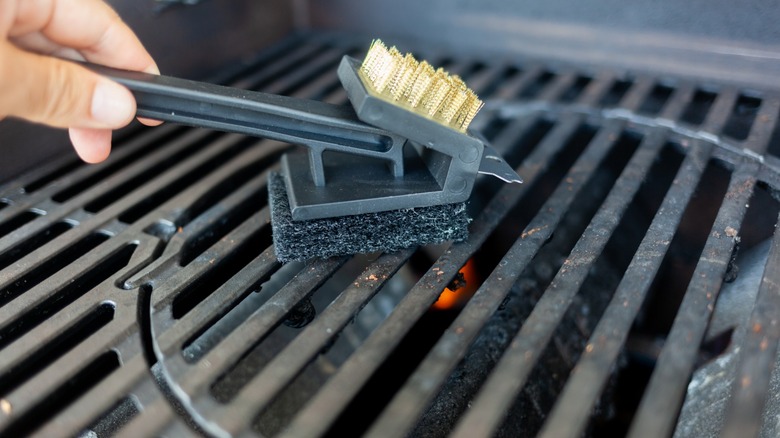 cleaning hot bbq grates using steel wool scrubber