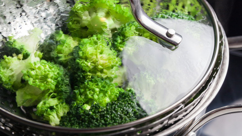 Freshly steamed green broccoli in skimmer pot