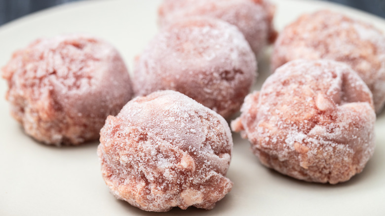 Frozen meatballs on a white plate