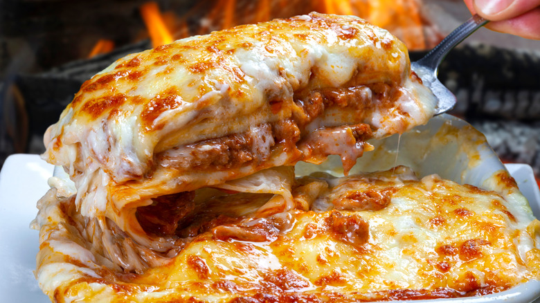 Rich and cheesy lasagna being served