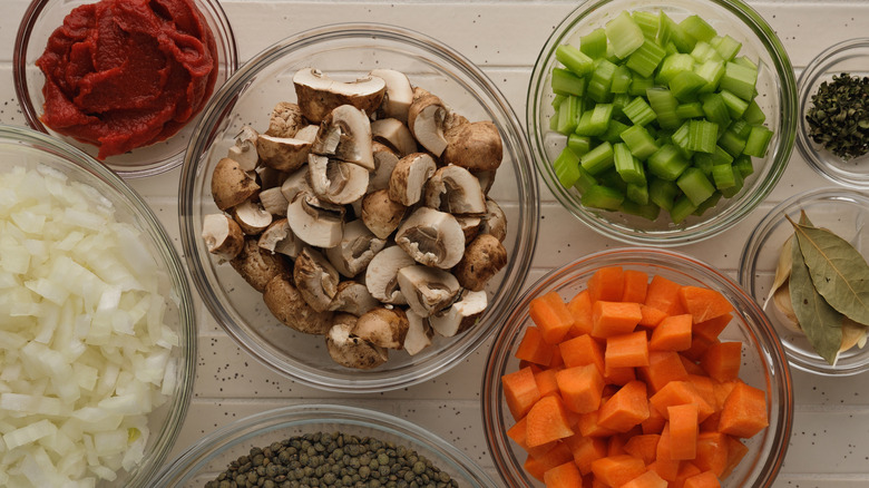 Assorted cut veggies in bowls for mise en place