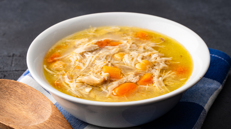 Chicken noodle soup with shredded chicken and carrots
