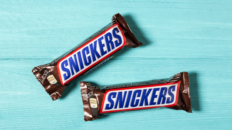Snickers bars against a blue background