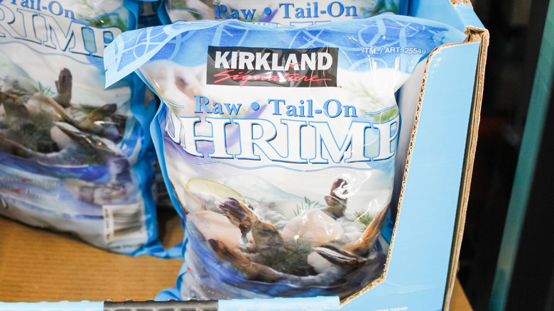 Several bags of Kirkland Signature tail-on shrimp