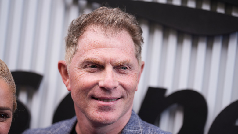 Bobby Flay smiling at event