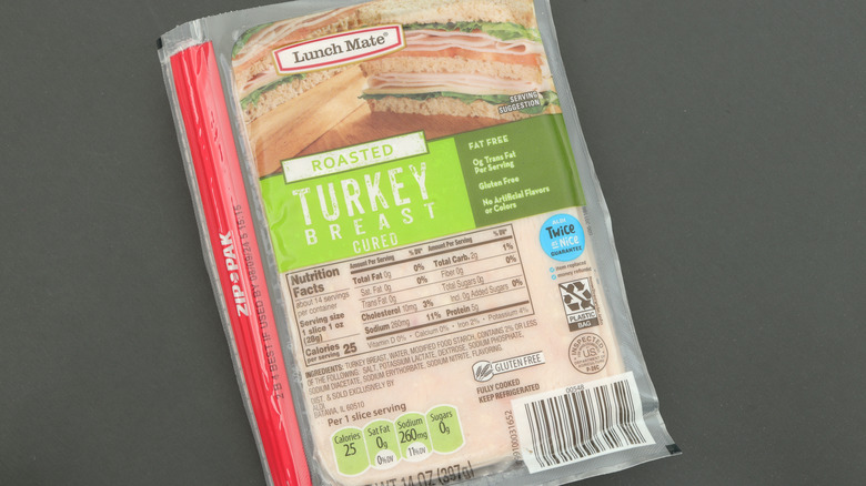 a package of aldi deli meat on a gray background