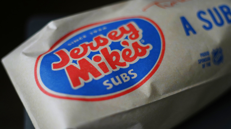 Jersey Mike's paper bag around sandwich, closeup.