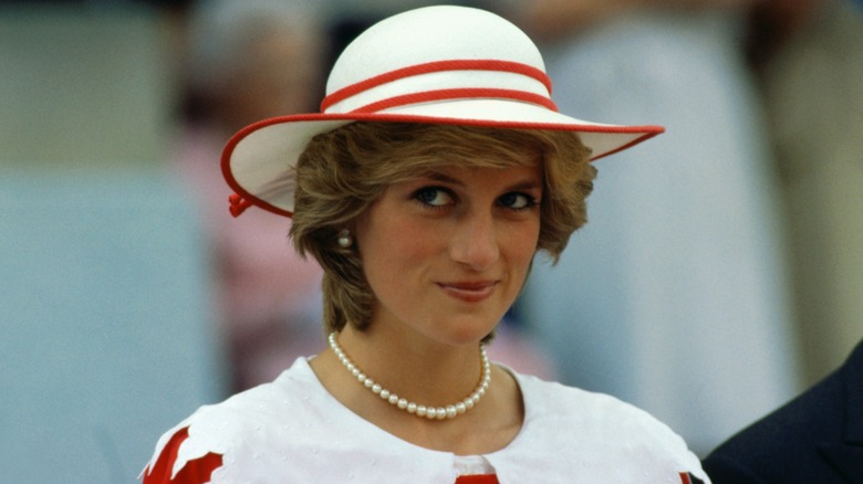 princess diana with red and white outfit and hat