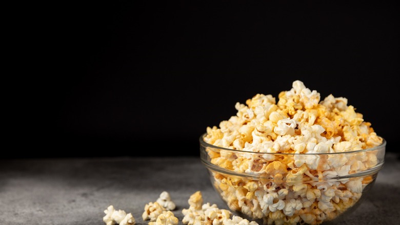 popcorn in bowl against black background