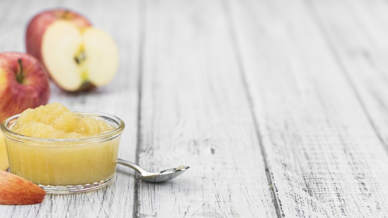 applesauce with apples on wooden table