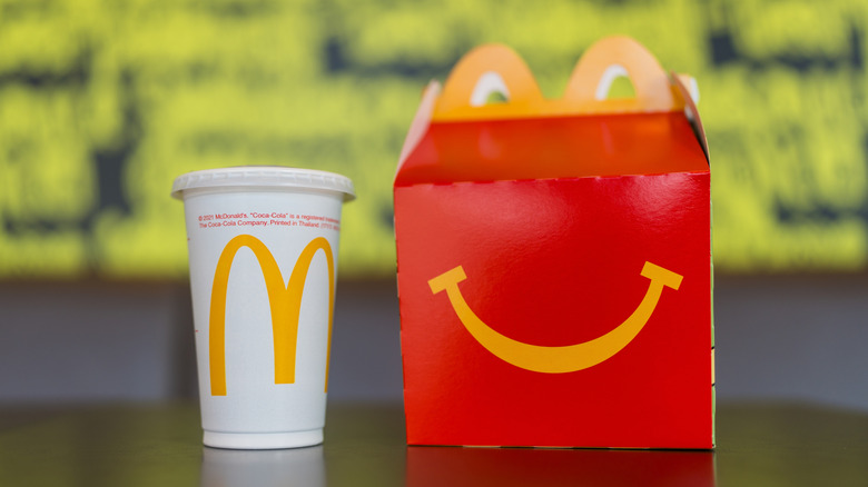 Happy Meal box with McDonald's drink cup on table