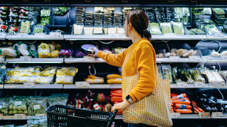 a woman shops at the supermarket