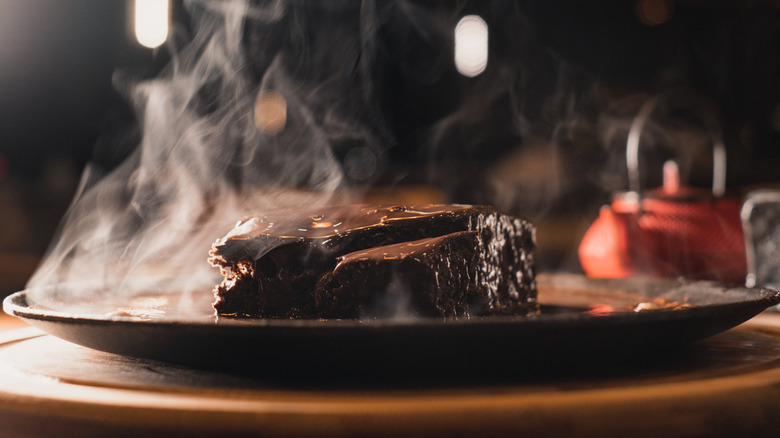 brownie with hot chocolate on plate