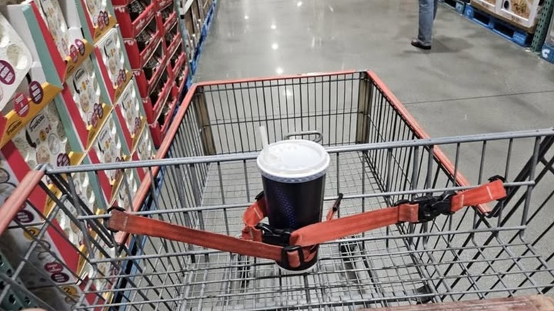 costco cup wrapped in baby straps on shopping cart