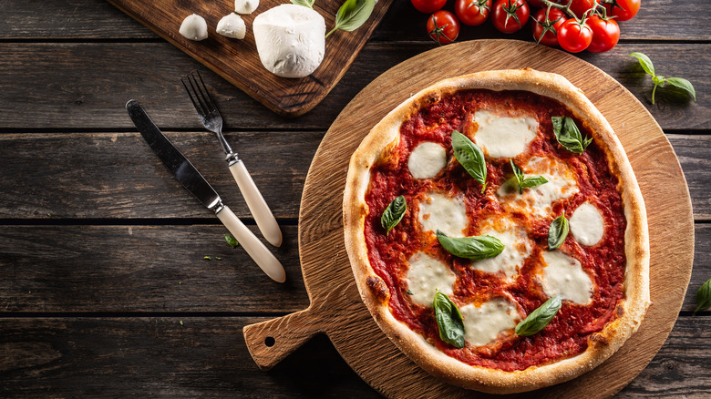 Pizza with melted mozzarella on a platter