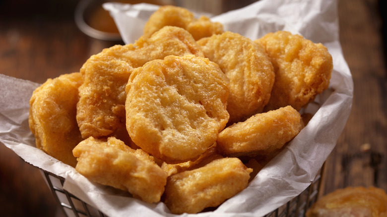 fryer basket filled with chicken nuggets