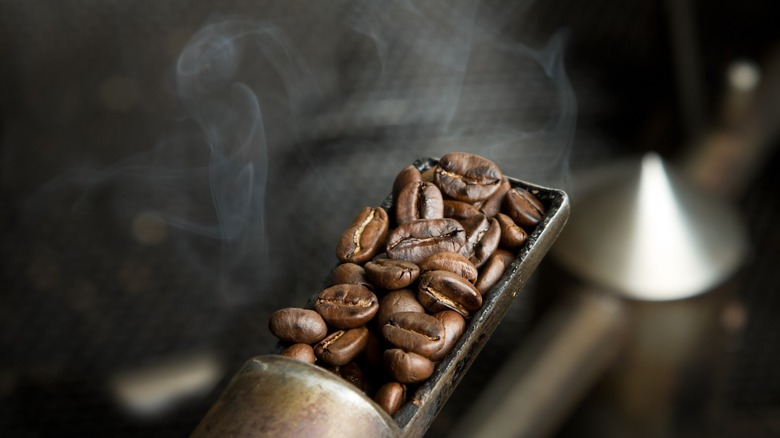 roasting coffee beans with smoke and heat