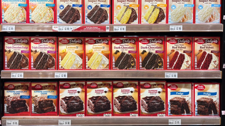boxed cake mixes on shelf at grocery store