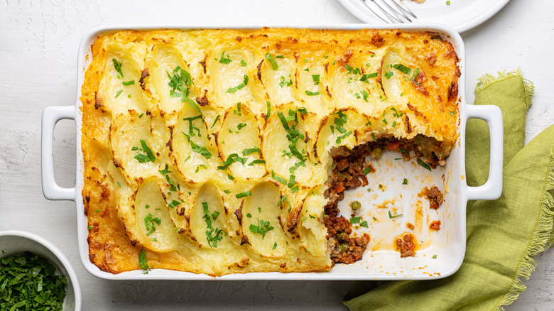 partially eaten cottage pie baked in casserole dish