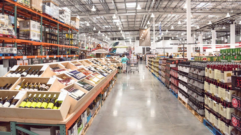 Customer shopping in liquor section of Costco store
