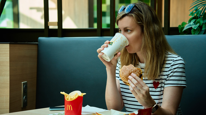 woman eating mcdonald's food