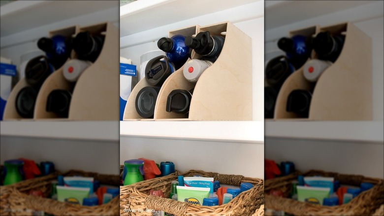 water bottles in magazine holders in pantry