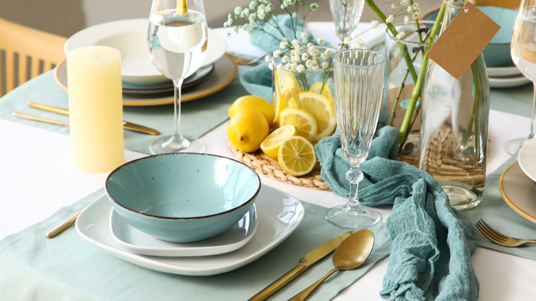 designed tablescape with layered and stacked plates and bowl