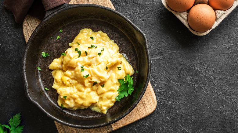 Overhead view of scrambled eggs in a skillet