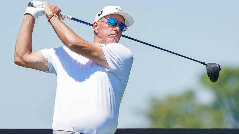 phil mickelson swings a golf club