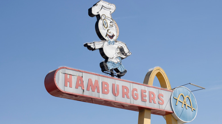 vintage mcdonald's sign with mascot and arch