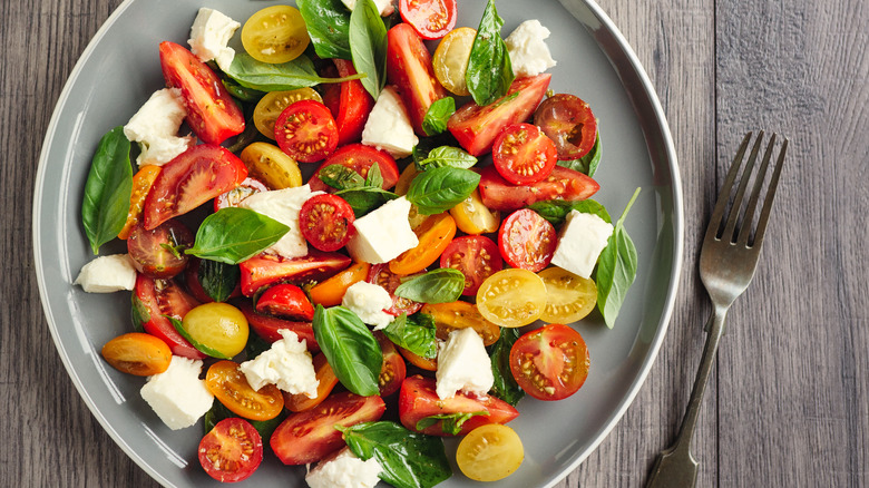 Close-up of caprese salad with cherry tomatoes on a plate