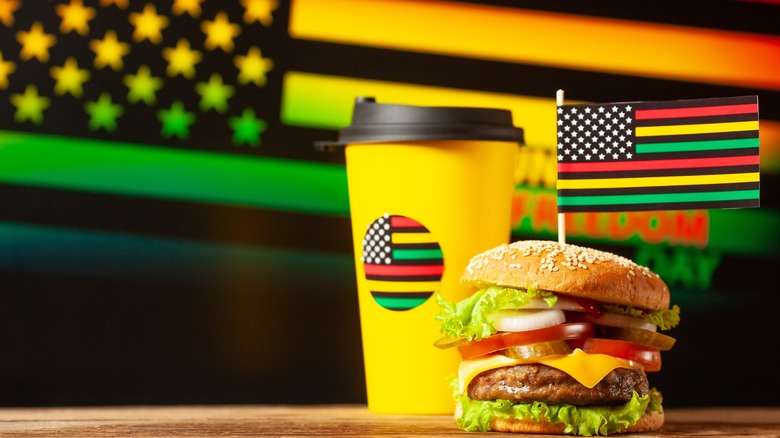 Juneteenth flag with a drink and burger