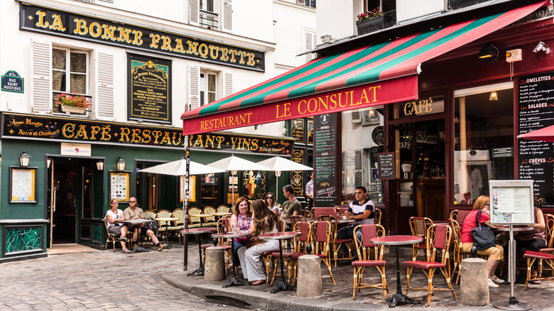 People sitting outside a French restaurant