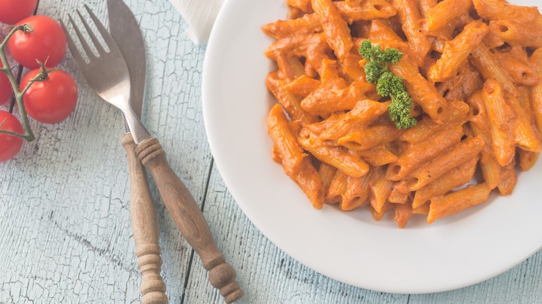 pasta dressed with a thick tomato cream sauce