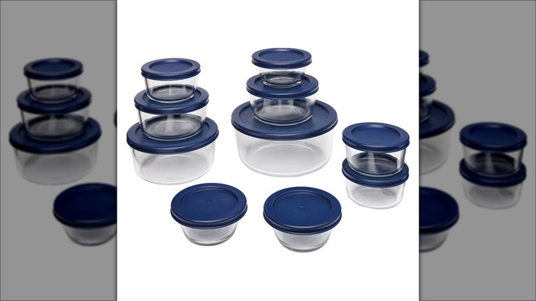A 20 piece set of glass storage containers from Crofton with blue lids