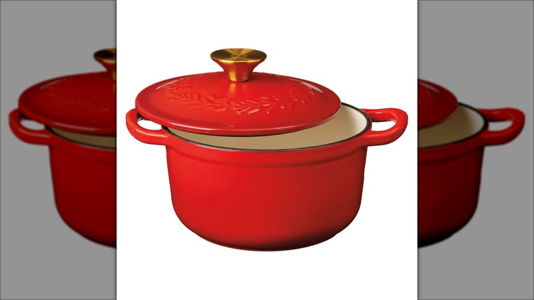 A red Merry Moments dutch oven