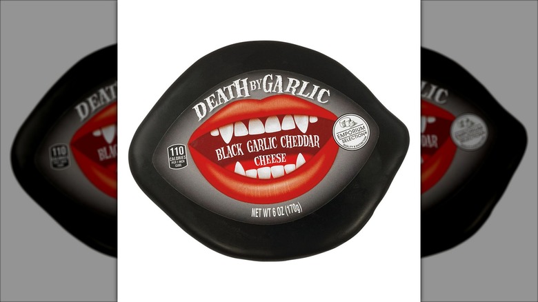 a black-wrapped package of cheese