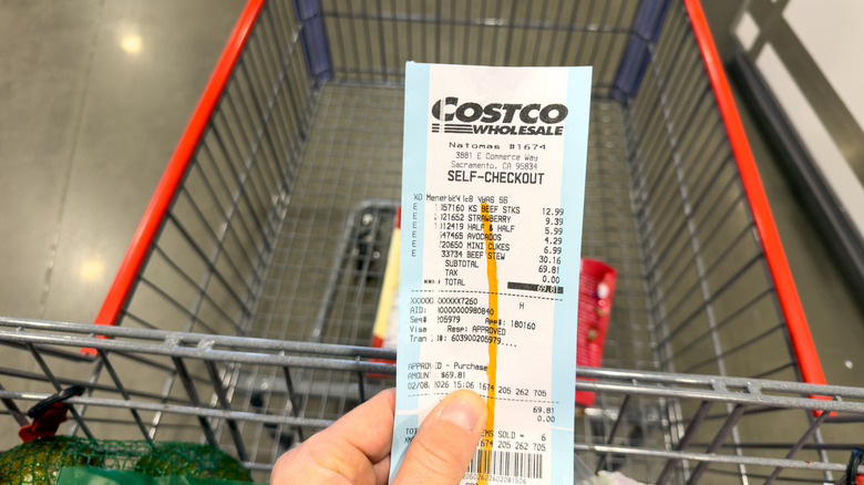 Someone holding a 2026 Costco receipt