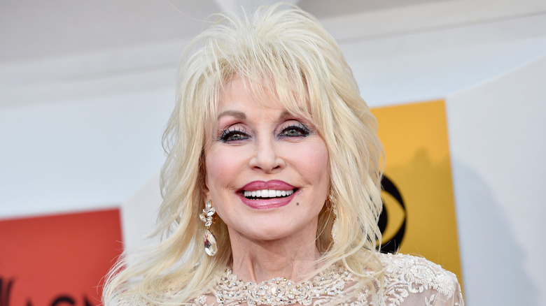 Dolly Parton in 2013 smiles for cameras