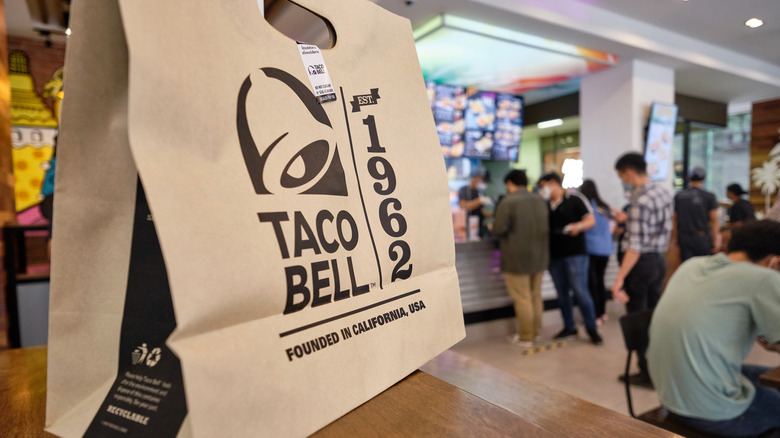 taco bell bag on table