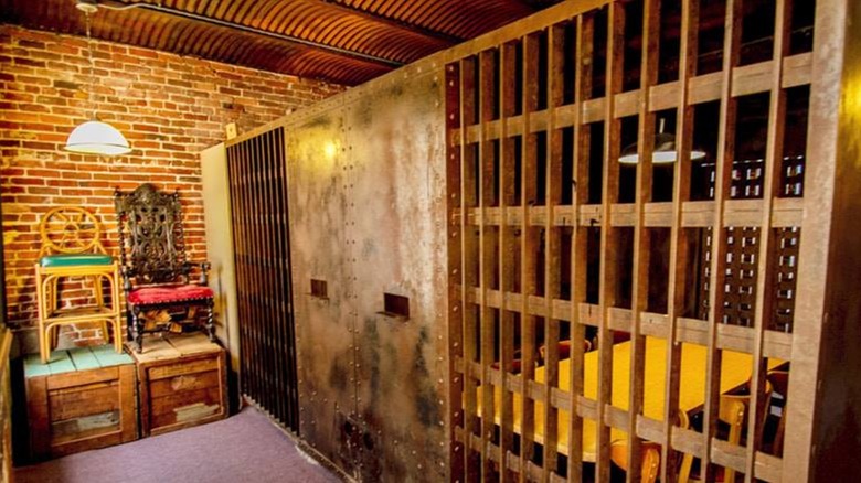 Interior of Jailhouse Pizza restaurant showing dining areas in old cells.