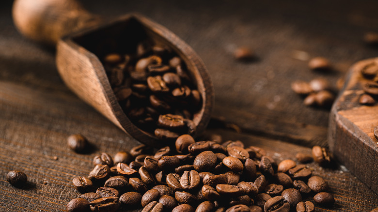 Coffee beans on wood background