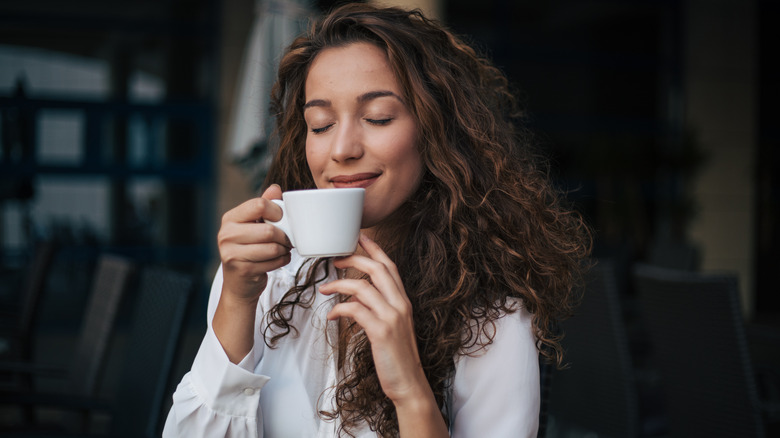 Woman sipping coffee