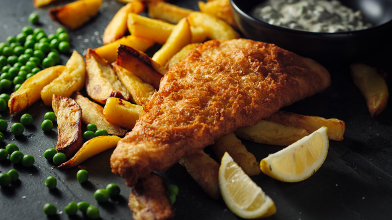 Fried fish with a side of potatoes