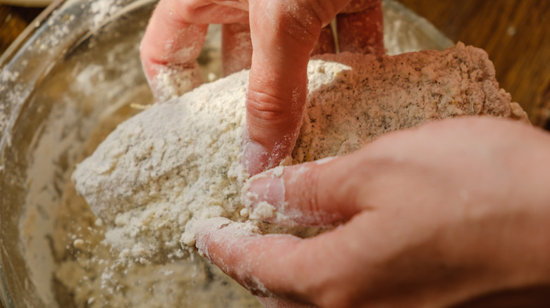 Dredging fish in flour